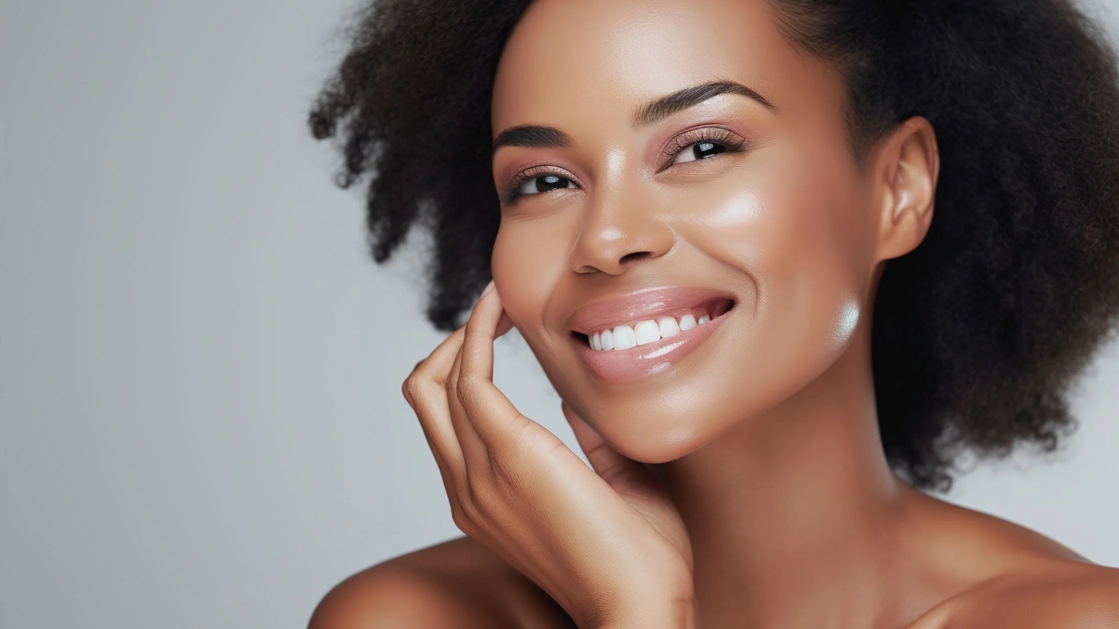 Smiling woman with glowing skin and moisturized lips showing natural skincare resultsRetryClaude can make mistakes. Please double-check responses.